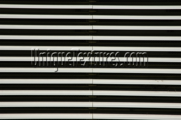 window vent/drain horizontal pattern shadow industrial architectural metal white black