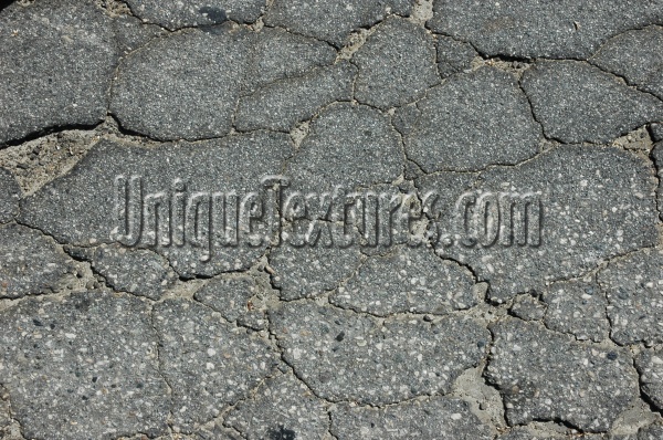 street cracked/chipped vehicle asphalt black