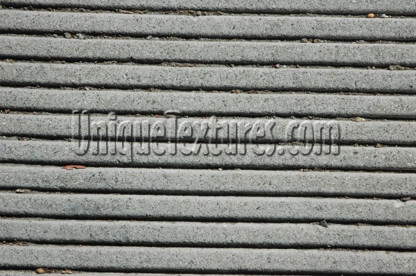 horizontal pattern grooved industrial concrete gray floor