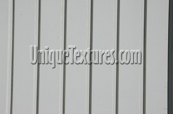 vertical pattern grooved architectural wood boards fence paint white