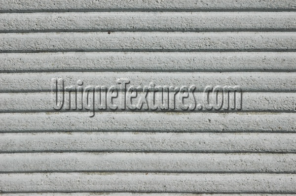 horizontal grooved industrial concrete gray floor