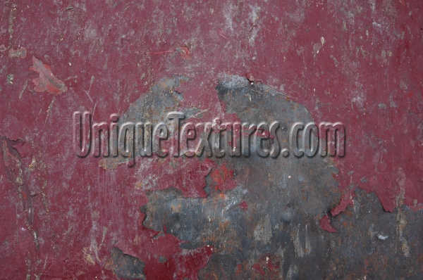 scratched industrial metal paint red