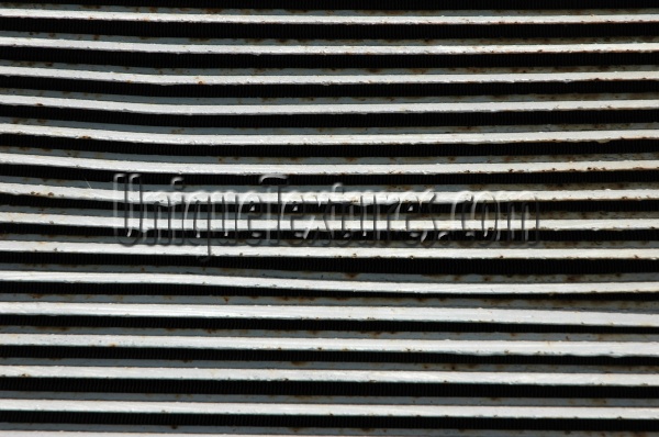 vent/drain horizontal shadow weathered industrial metal gray