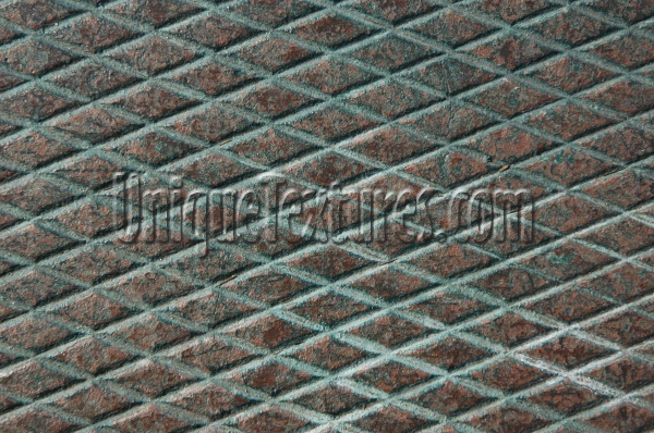 manhole angled diamonds pattern grooved rusty industrial metal dark brown