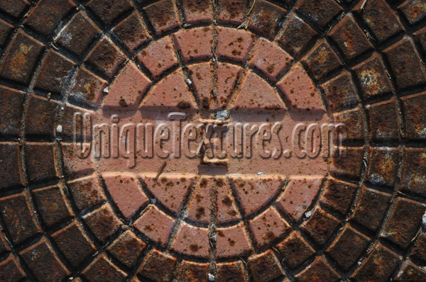 manhole pattern shadow textual rusty industrial metal multicolored       