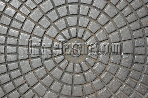 manhole pattern textual shiny industrial metal metallic