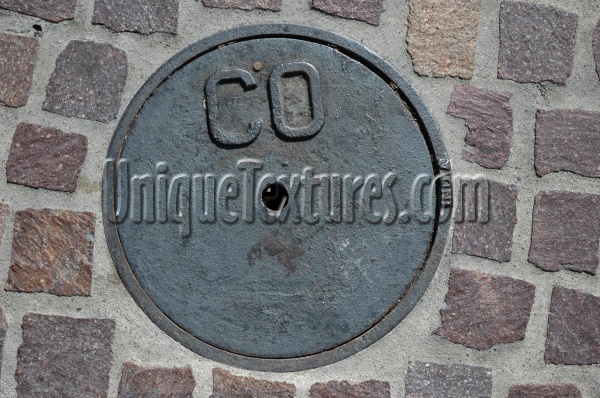 manhole round textual industrial metal brick dark brown