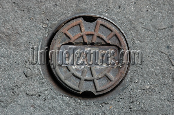 manhole round textual industrial metal concrete gray   