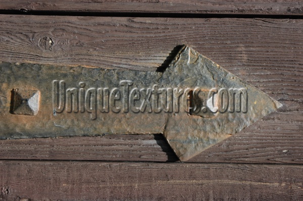 door fixture fastener horizontal    triangular weathered architectural wood metal dark brown