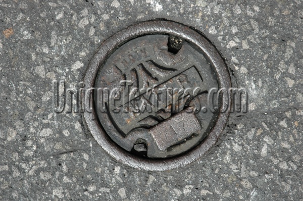 door street vent/drain manhole round textual industrial metal concrete gray   