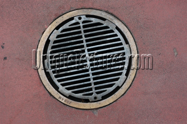 red metallic concrete metal industrial round angled vent/drain street