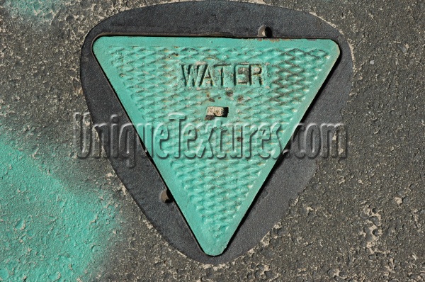 street   manhole triangular diamonds textual industrial metal concrete paint green