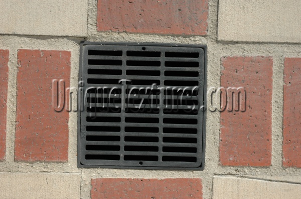 street vent/drain square pattern industrial architectural metal brick gray