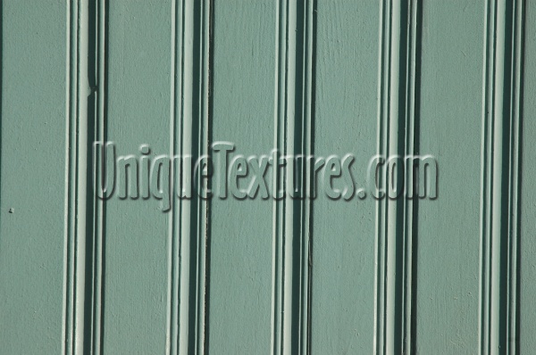 green wood architectural grooved vertical fence