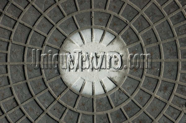 gray white metal industrial textual round pattern manhole street
