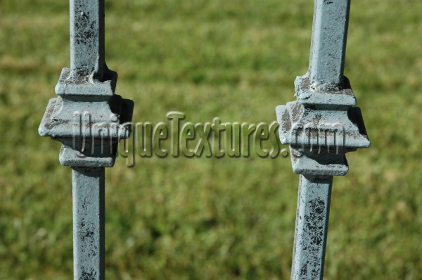 green metal architectural art/design weathered vertical fence