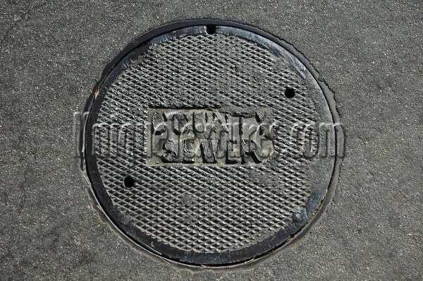 gray metal asphalt industrial textual round diamonds manhole street