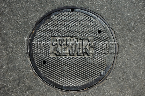 gray metal asphalt industrial textual round diamonds manhole street
