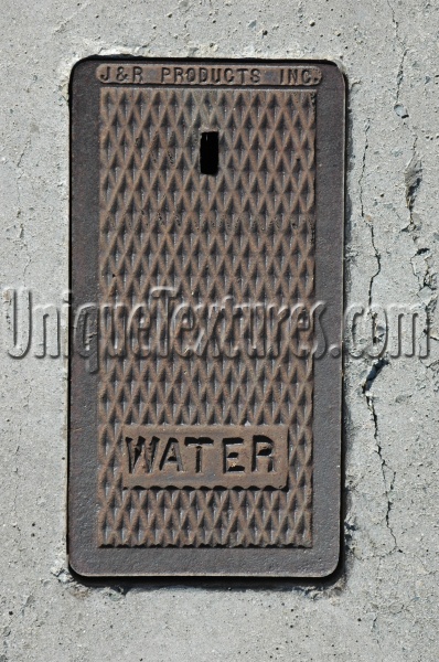 door manhole rectangular diamonds textual rusty industrial metal dark brown gray