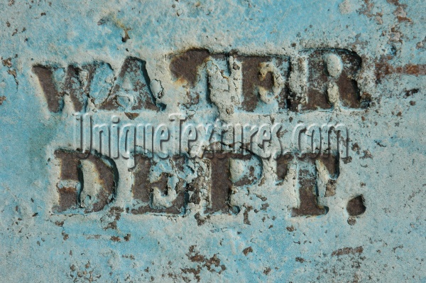 blue paint metal industrial bleached scratched weathered textual sign manhole