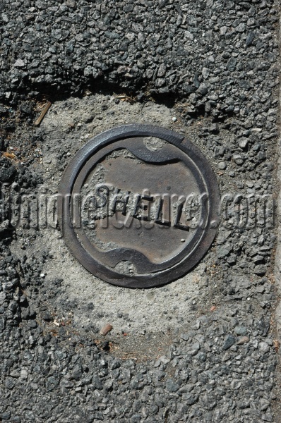 gray metal asphalt industrial textual round manhole street