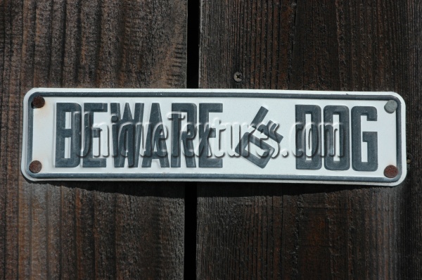 black white metal wood architectural textual sign