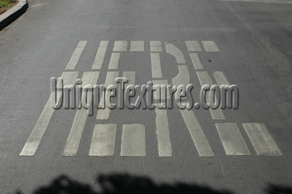 gray white paint asphalt vehicle oblique sign