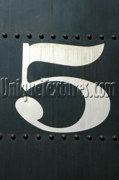 white sign industrial metal paint         art/design vehicle black numerical stained