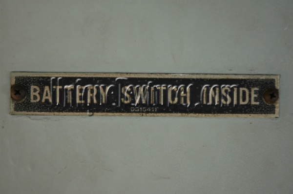 gray metal industrial mech/elec textual rectangular horizontal sign