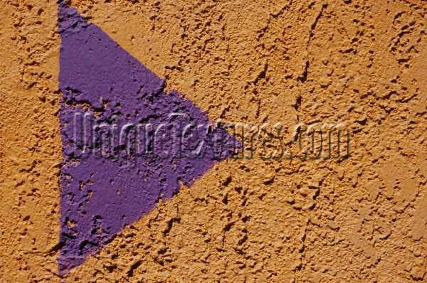 symbol wall triangular rough architectural stucco/plaster paint purple yellow