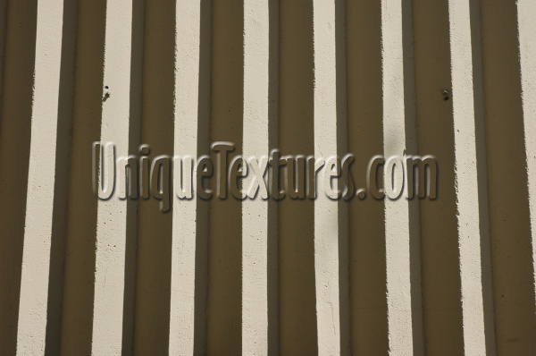 gray concrete architectural shadow grooved vertical wall