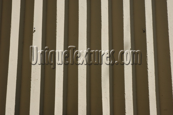 gray concrete architectural shadow grooved vertical wall