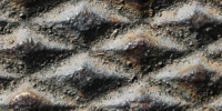 manhole diamonds pattern rusty industrial metal dark brown gray  