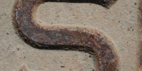 manhole curves textual rusty industrial metal dark brown