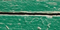 horizontal weathered architectural wood paint green