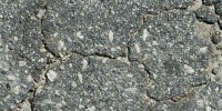 street cracked/chipped vehicle asphalt black