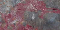 scratched industrial metal paint red