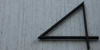 sign triangular      oblique numerical industrial concrete gray