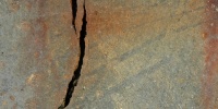 cracked/chipped rusty marine concrete gray floor