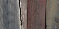 fence wall vertical cracked/chipped weathered architectural wood gray boards