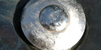 fixture vent/drain round wet shiny industrial metal metallic   