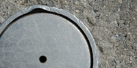 door manhole round shiny industrial metal concrete metallic gray   