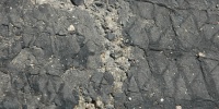 black asphalt vehicle dirty cracked/chipped wheel street