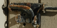 fixture boards fence shadow weathered rusty industrial wood metal gray