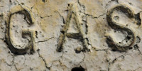 yellow paint metal industrial bleached weathered cracked/chipped textual sign