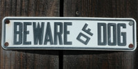 black white metal wood architectural textual sign