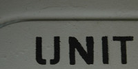 gray black paint metal industrial textual sign