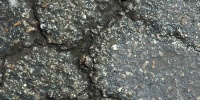 black asphalt vehicle cracked/chipped wet random street