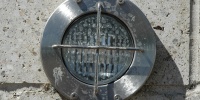 gray metallic concrete metal mech/elec shiny round wall fixture