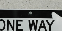 sign rectangular vehicle metal concrete white black gray